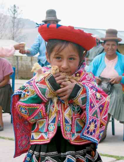 Heifer International gives the gift of livestock to those in need. This Peruvian child received baby chicks last summer.